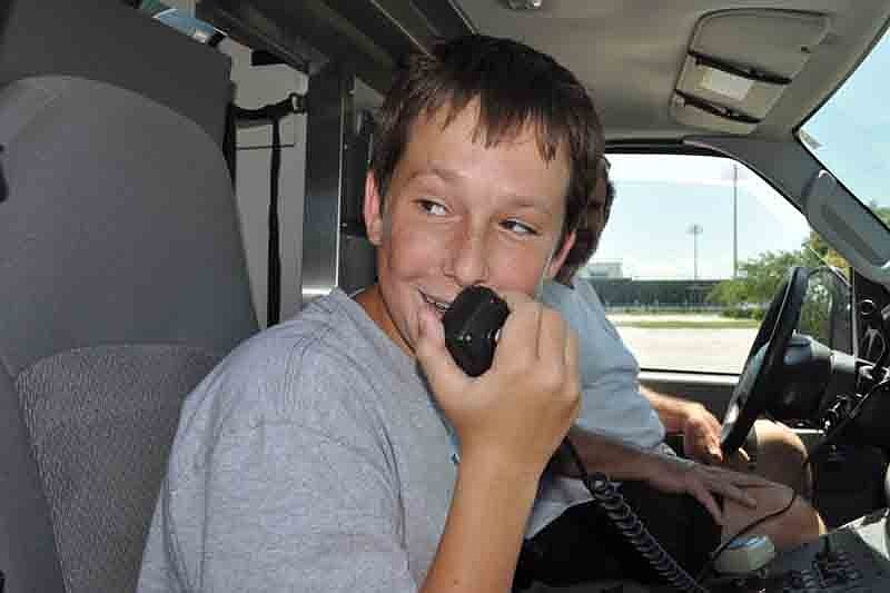 Joe Resnick, 14, had fun singing into the Emergency Response Vehicle's intercom system during a training exercise.