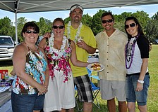 Paula Egan, Sandra Edwards, Matt Brannan, Brad Moyer and Stephanie Brannon of Integrity Title made a Hawaiian hot dog.