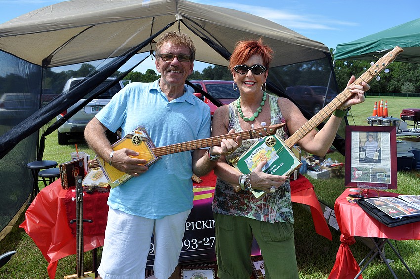 Steve Cinnamon, pictured with his wife Sue Anne, makes cigar box guitars.