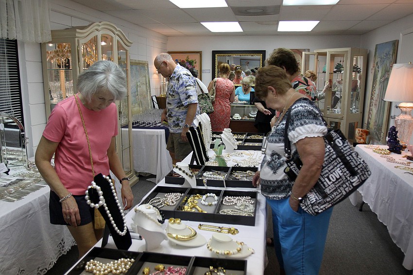 People browsed the jewelry and other trinkets that were for sale Friday, July 22 at the estate sale.