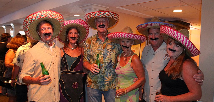 Mike and Cyndi Seamon, Bill and Meike Dooley and Chris and Patty Sileo dressed up in sombreros and mustaches Friday, July 22 for the Interactive Mexico dinner at Pattigeorgeâ€™s.