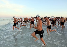 The first wave of Olympic triathletes hit the water at 7 a.m. Saturday, July 23 as part of the Siesta Key Triathlon out at Siesta Key Public Beach
