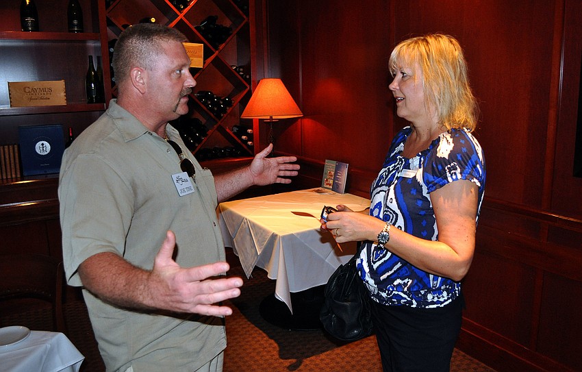 Joe Tine and Shelia Lewis talk about their business prior to having lunch Thursday, July 28 at Fleming's Prime Steakhouse & Wine Bar.