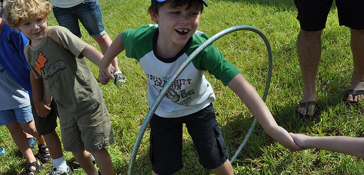 Michael Rixon made his way through the hoop without letting go of his neighbor's hands.