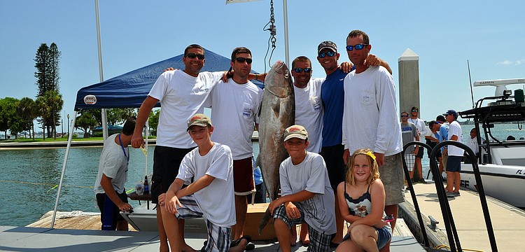 Team Dirt Dragger posed with their 61 lbs. Amberjack Saturday, August 6 during the Sarasota Slam weigh-in at Marina Jackâ€™s.