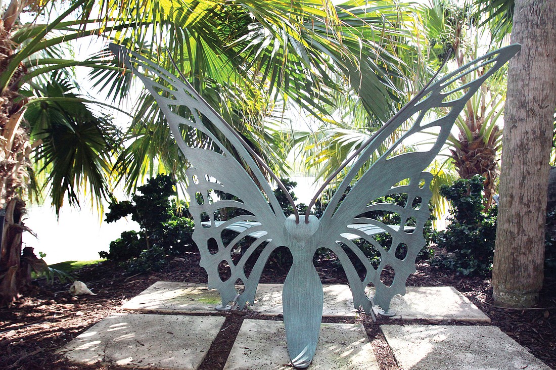 An ornate butterfly chair in the backyard is a special place for the owners to relax.