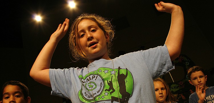 Kailee Carrier helped lead her fellow campers in a song on the last day of Vacation Bible School.