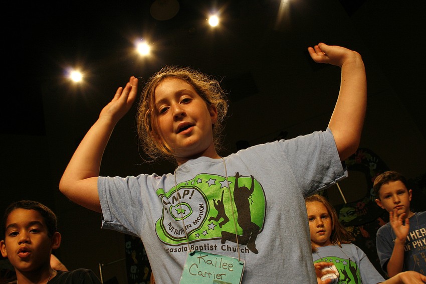 Kailee Carrier helped lead her fellow campers in a song on the last day of Vacation Bible School.