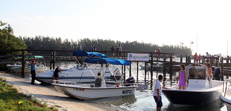 People start to board their boats to head out to look for scallops Saturday, August 13 during the 4th Annual Sarasota Bay Great Scallop Search.