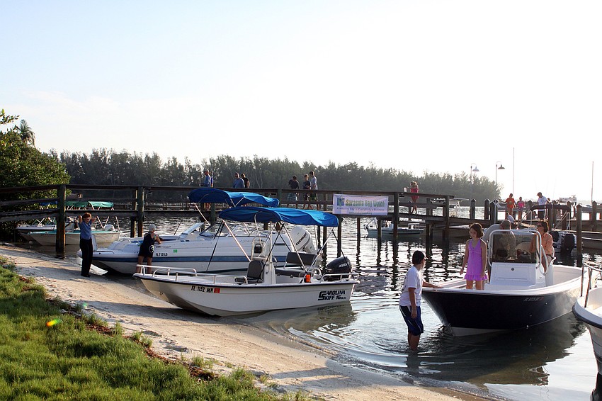 People start to board their boats to head out to look for scallops Saturday, August 13 during the 4th Annual Sarasota Bay Great Scallop Search.