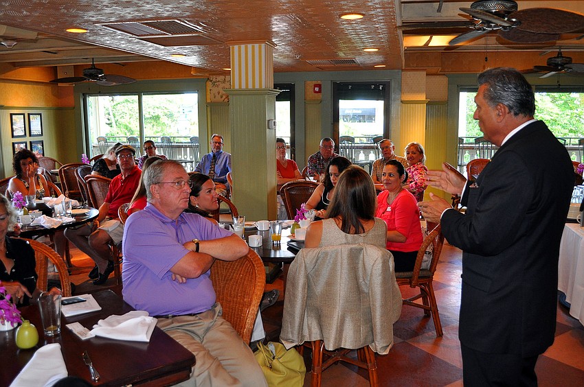 President Andrew Vac speaks to the members of the Circle Association Tuesday, Aug., 16 at Tommy Bahama Restaurant.