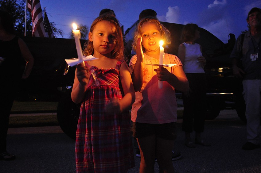 Four-year-old Alyssa Sparks and her 5-year-old sister, Bryanna, didn't know Patrick Lay but wanted to show their support.