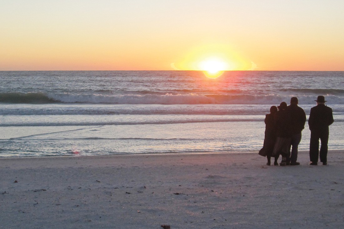 Robert Frederickson submitted this photo of a group of Mennonites enjoying the Siesta Key sunset.