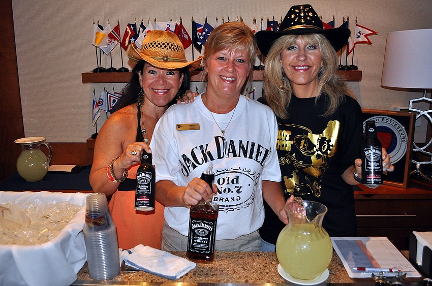 Sandra Ceshker, Tamera Jackson and Betty Pawlowitz pose with Jack Danielâ€™s and lemonade Saturday, Aug. 20 at the Sarasota Yacht Club.