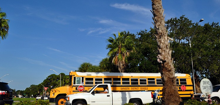 A Sarasota County school bus makes its way along Tamiami Trail this morning with the rest of the morning traffic. Today is the first day back for many of the schools in Sarasota County.