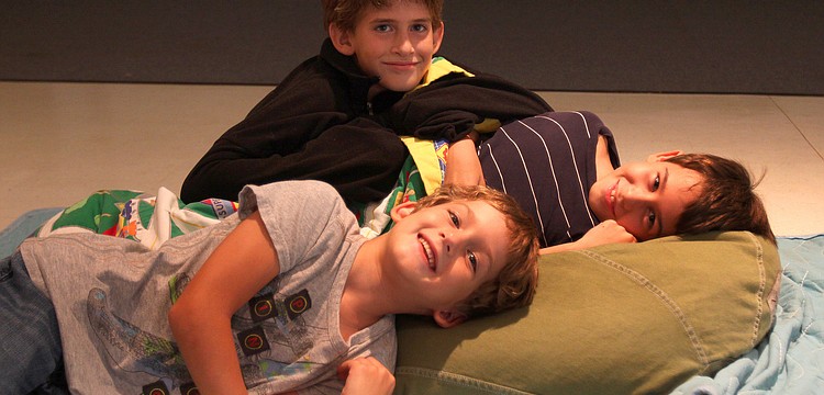 Max, 10, Sam, 8, and Jack, 5, Sugar pile on one another Friday, Aug. 26 in the Parish Hall.