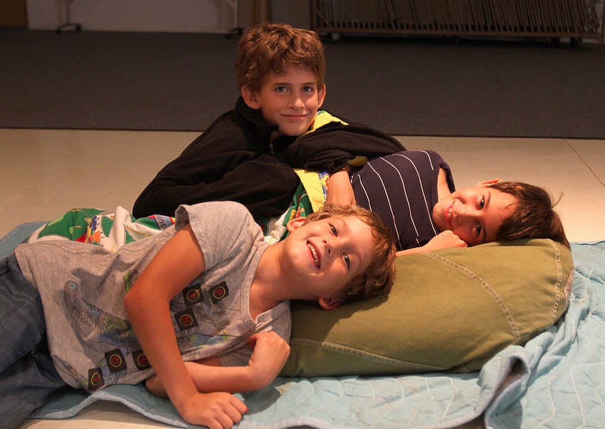 Max, 10, Sam, 8, and Jack, 5, Sugar pile on one another Friday, Aug. 26 in the Parish Hall.