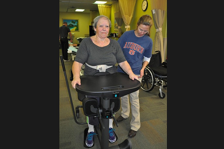 Florida Hospital Flagler physical therapist Laurel Gaddy helps Maria Azevedo start walking again. (Courtesy photo.)