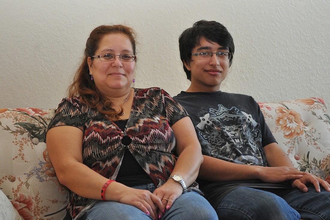 Sandra Valentine and her son, Isaiah, 17, found a new apartment near State Road 100 and moved in a week later. (Photo by Jonathan Simmons.)