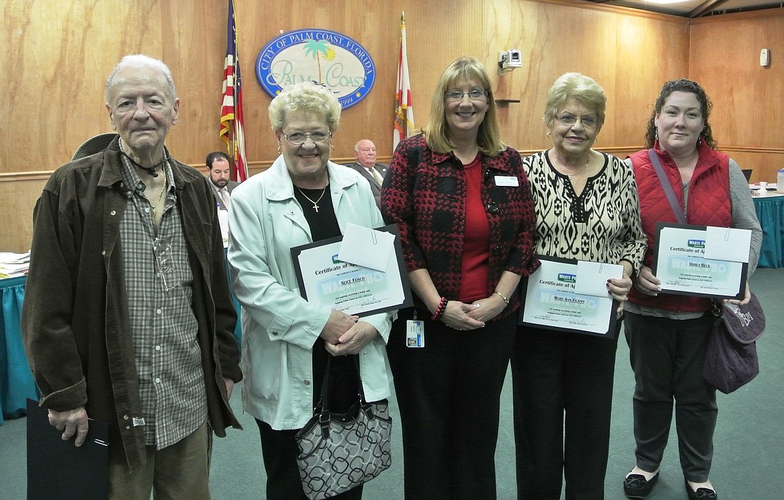 Palm Coast Contracts and Risk Manager Dianne Torino, center, presents quarterly prizes to, from left: Ralph Ascione, Alice Fusco, Mary Ann Filippi and Darla Beck. COURTESY PHOTO