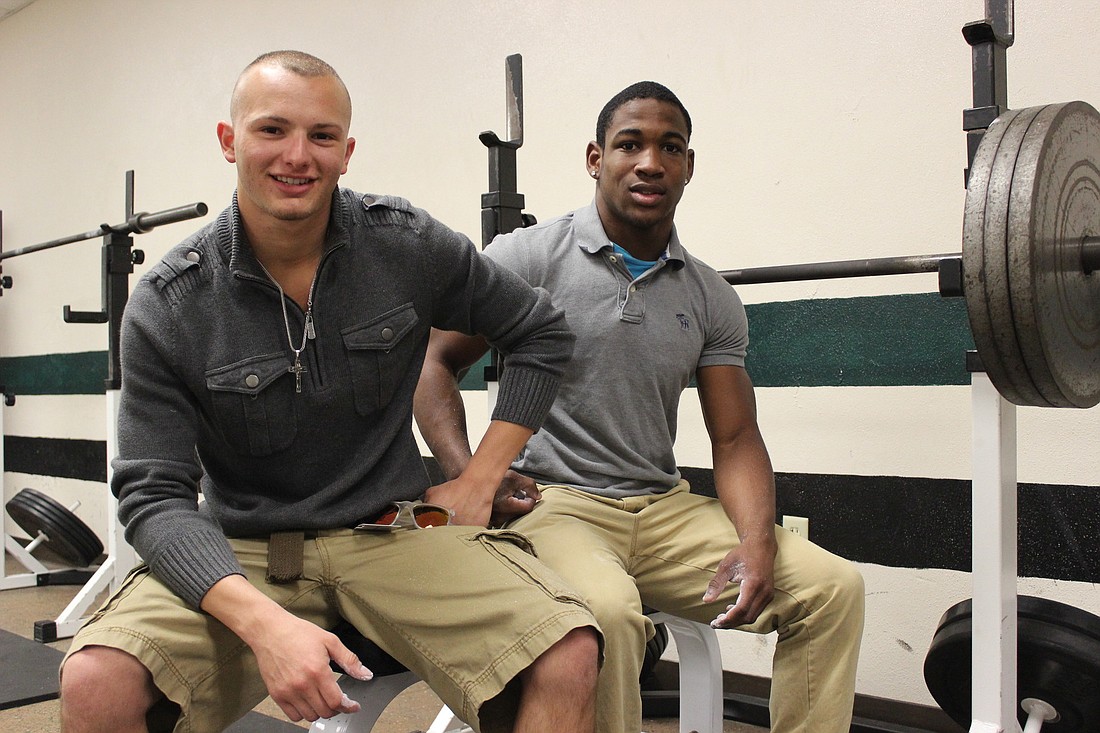 Flagler Palm Coast weightlifters Carl Lilavois (left) and Marcus Polite suffered defeat last season. That sting has left them motivated this season. (Andrew O'Brien)