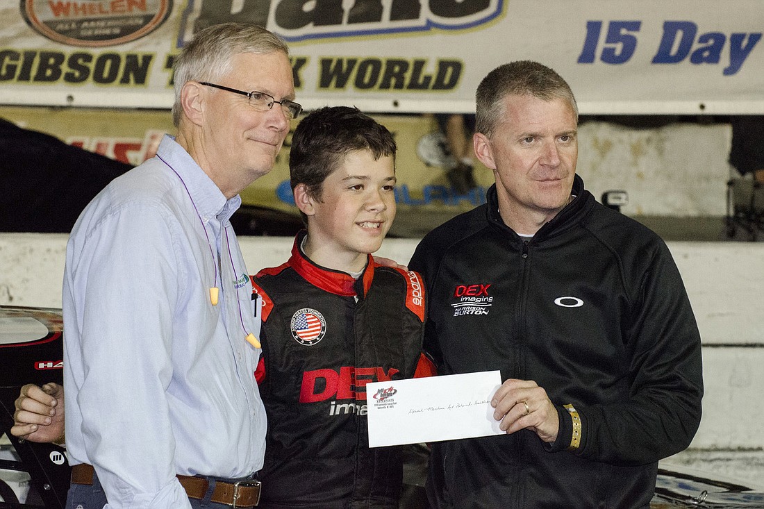 Stewart-Marchman-Act Behavioral Healthcare CEO Chet Bell, race car driver Harrison Burton, and his father and fellow race car driver Jeff Burton. (Courtesy photo.)