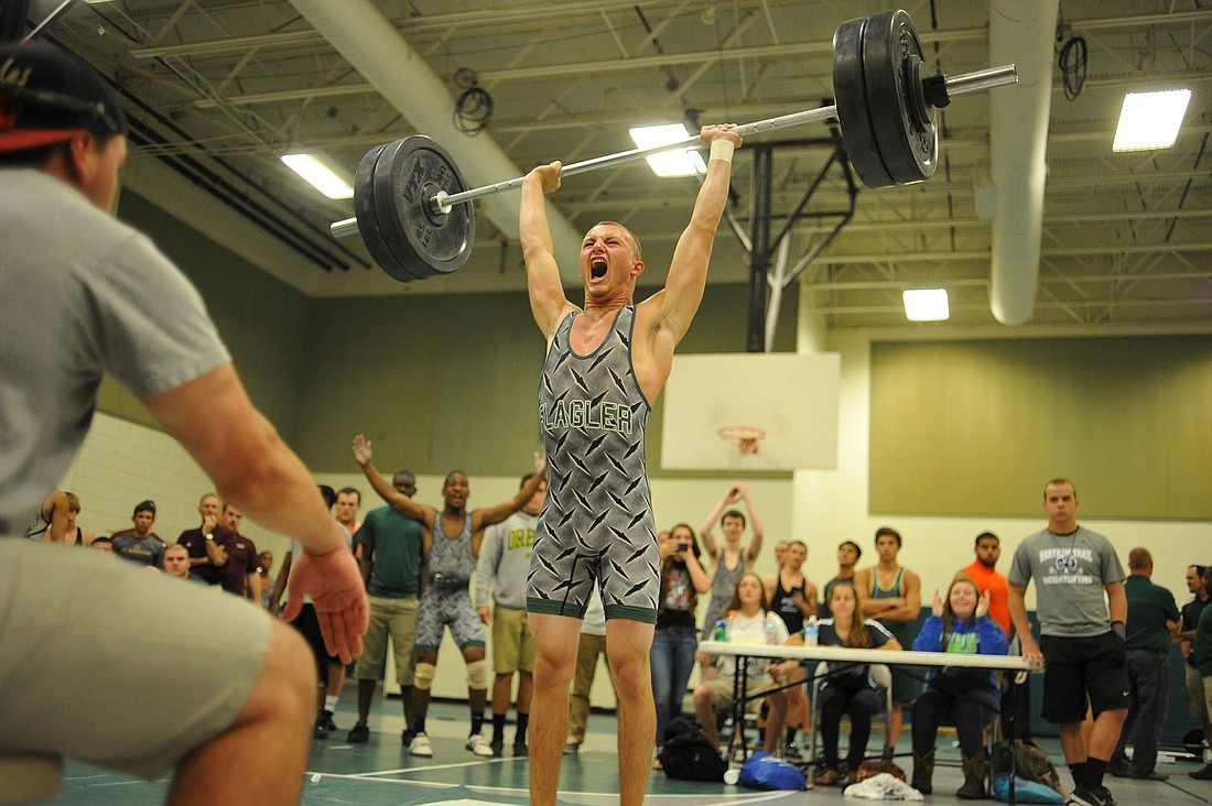 FPC's Carl Lilavois reacts after clean and jerking 240 pounds, a new personal record, at the sectional weightlifting meet on Friday. (Photo by Joey LoMonaco)