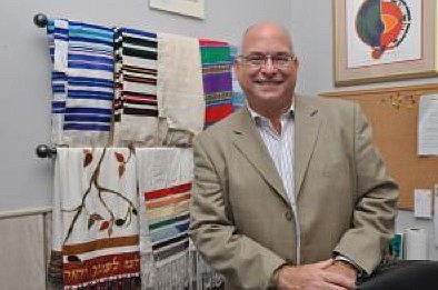 Temple Beth Shalom Rabbi Zev Sonnenstein collects prayer shawls. (Photo by Shanna Fortier.)
