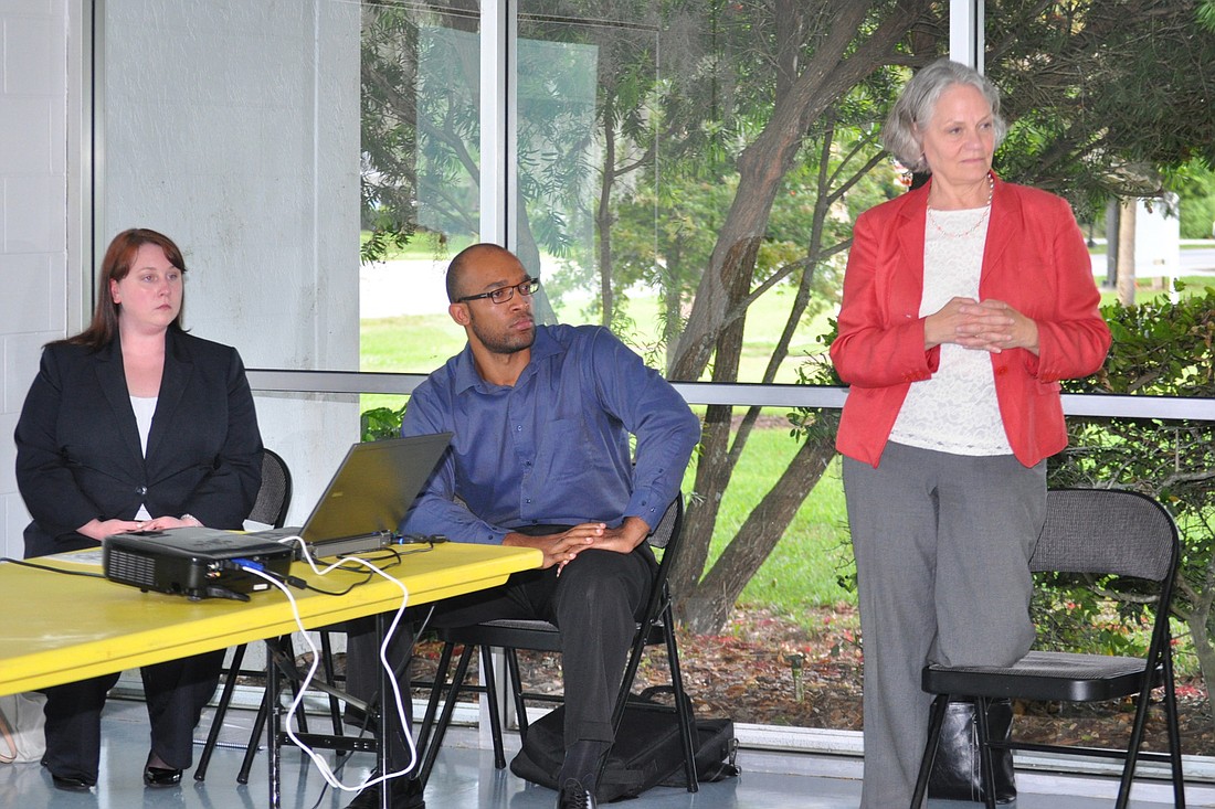 Barry University law school students Margaret Stewart and Joshua Mayo, and Professor Rachel Deming, spoke with Florida Park Drive residents concerned about heavy traffic on the residential street. (Photo by Jonathan Simmons.)