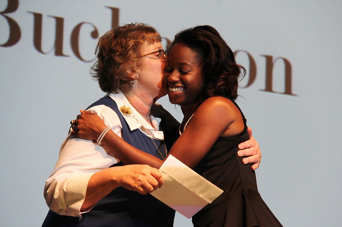 Crystal Buchanon accepts a scholarship from Kathy Summerlot. PHOTOS BY SHANNA FORTIER
