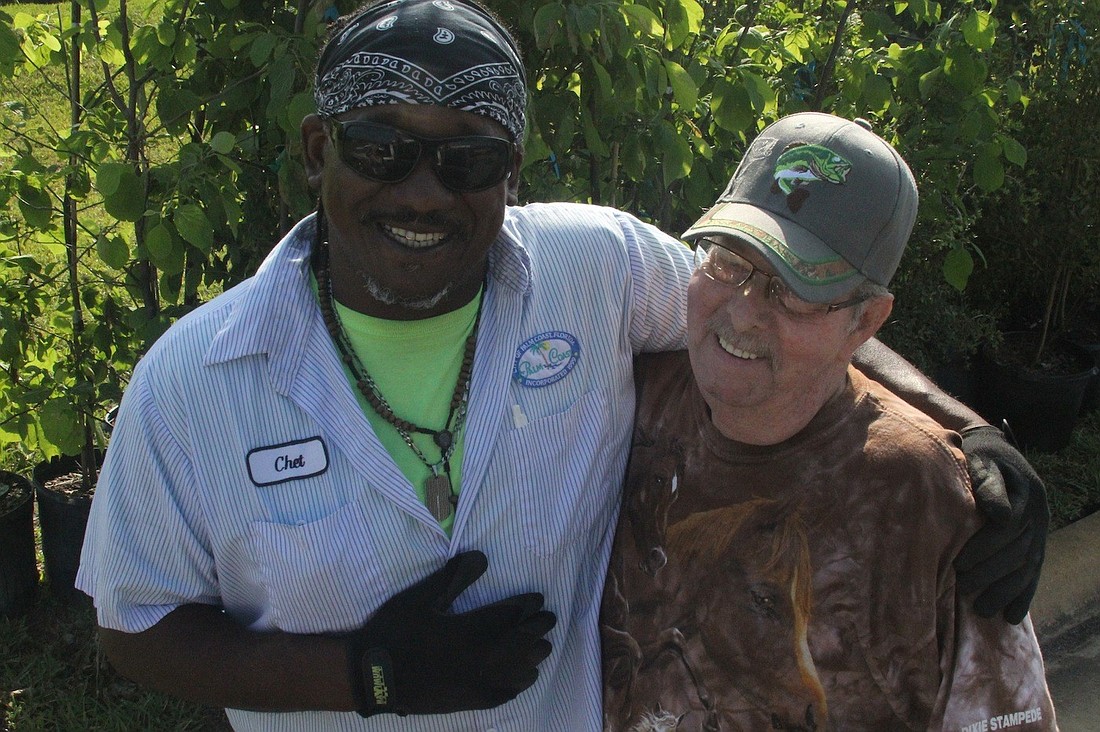 City landscaper Chet Henry helped William Ruff, of Birchfield Place, select a tree to replace one that was taken down by the Dec. 14, 2013, tornado.