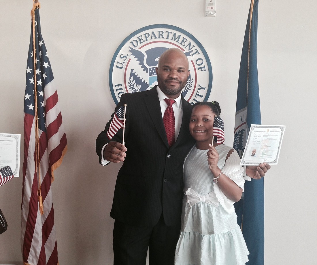 Juan E. Bostwick and his daughter Jazmine celebrate the American dream. COURTESY PHOTO