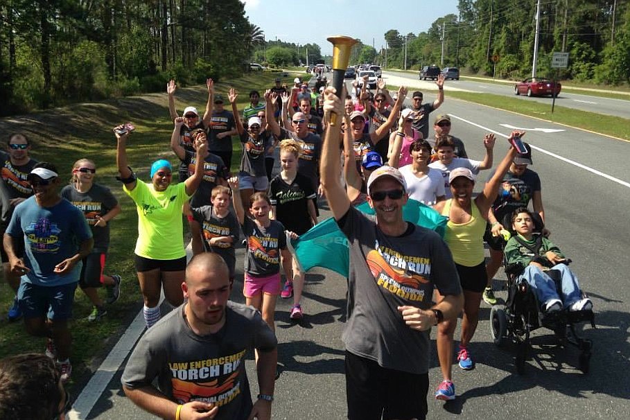 Deputies and their families, citizens and Special Olympics athletes participated in the Law Enforcement Torch Run April 26. (Photo courtesy of the Flagler County Sheriff's Office.)