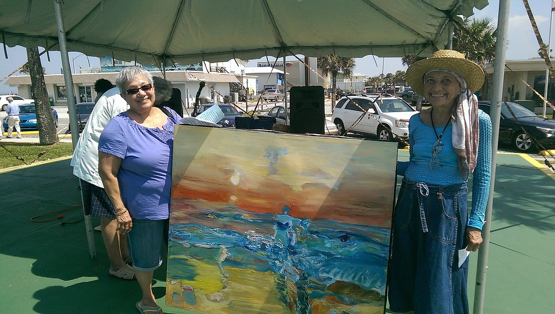 Raffle winner Phyllis Garcia and artist Linda Solomon COURTESY PHOTO