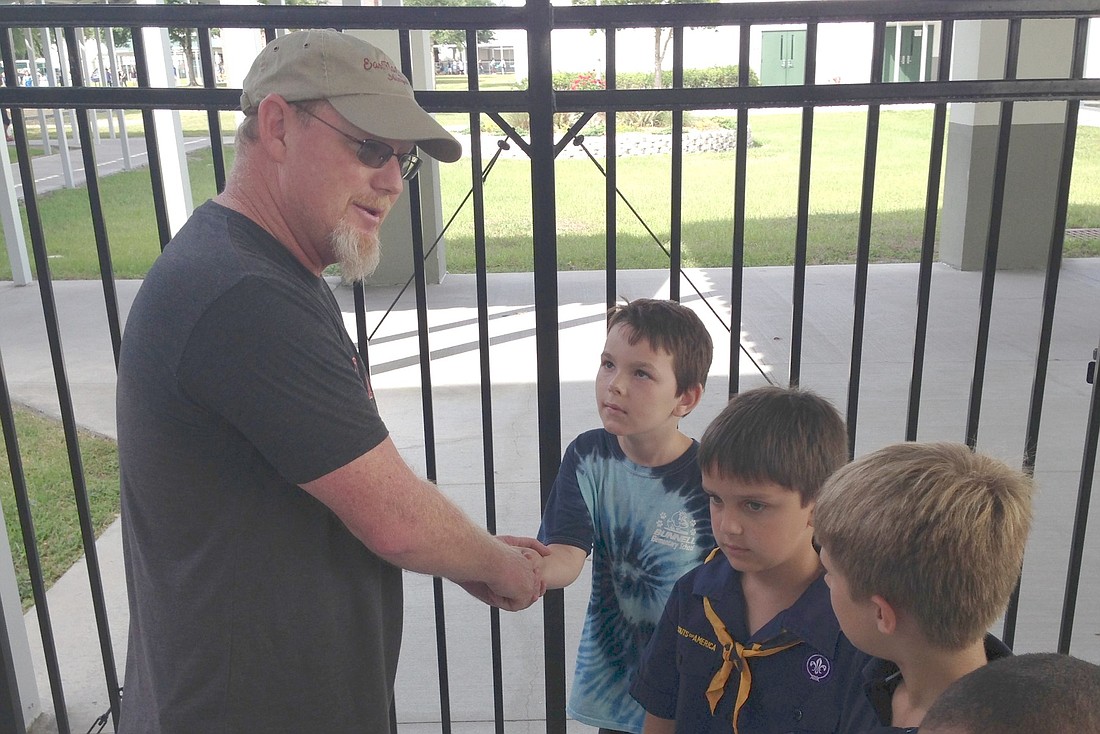 Robert Fisch thanks Richard Van Leer and Cub Scout Pack 437 for helping to install a memorial to FischÃ¢â‚¬â„¢s wife, Dawn Renee Fisch.