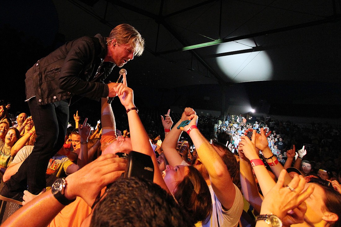 Switchfoot lead singer Jon Foreman becomes one with the crowd May 31, at the St. Augustine Amphitheatre. PHOTO BY SHANNA FORTIER