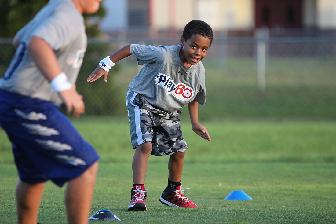 Camper DJ Murray takes part in an agility drill at NFL Play 60 camp on Friday. (Joey LoMonaco)