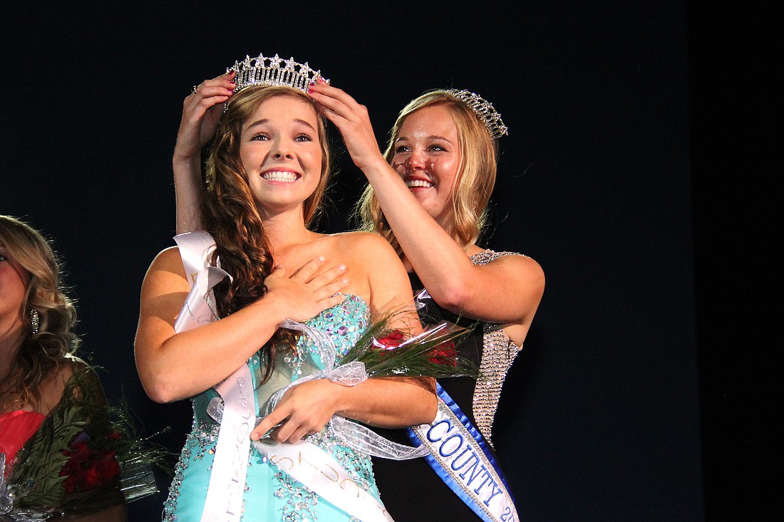 Windsor Mills is crowned 2014 Miss Flagler County by the reigning queen Riley Shugg. PHOTO BY SHANNA FORTIER