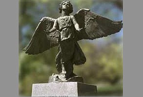 The angel statue is 4 feet, 3 inches tall, with a wingspan of 5 feet, 2 inches.
