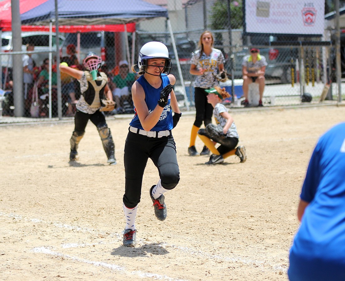 Sierra Luther tries to beat out a play at first. (Joey LoMonaco)