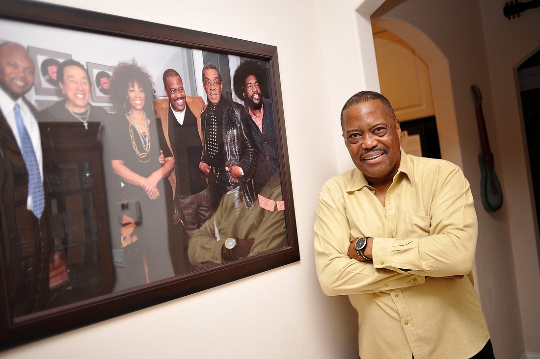Cuba Gooding Sr. poses with a portrait of some of R&B music's all-time greats. (Joey LoMonaco)