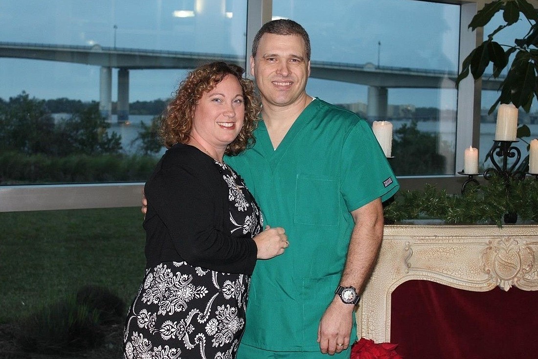 John Raymond, pictured here with his wife, Kay, has been a nurse for 18 months. He turns 44 on July 17. (Courtesy photo)