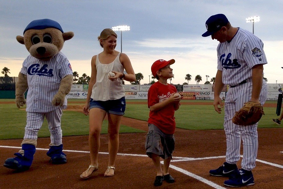 Maureen Walsh and Grant McMillan return after each successfully throwing a first pitch July 17, at Observer Night at the Daytona Cubs.