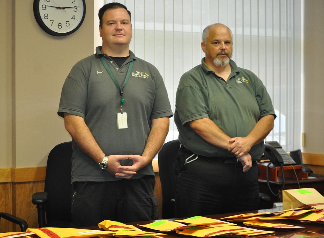 Flagler County SheriffÃ¢â‚¬â„¢s Office evidence custodians Mark Judd and Jason Prather deal with about 4,000 pieces of evidence a year. Much of their time is spent reading legal dispositions to determine what can legally be released to whom.