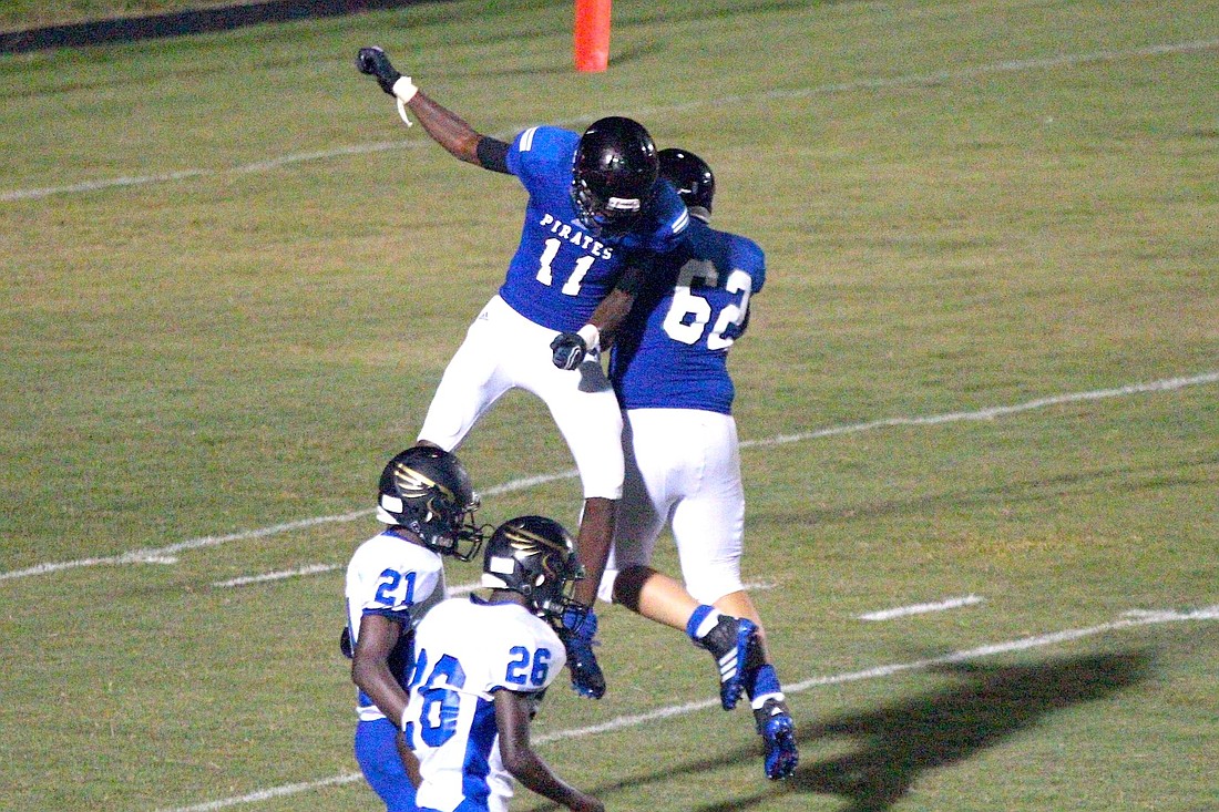 Andre Bodison celebrates the game-winning touchdown catch with lineman Amar Albakri (62). (Photo by Brian McMillan)