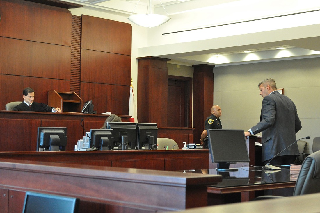 Attorney Joshua Knight, at right, wanted Judge Dennis Craig to allow him to amend his lawsuit. Craig instead dismissed it on the basis of jurisdiction. (Photo by Jonathan Simmons.)