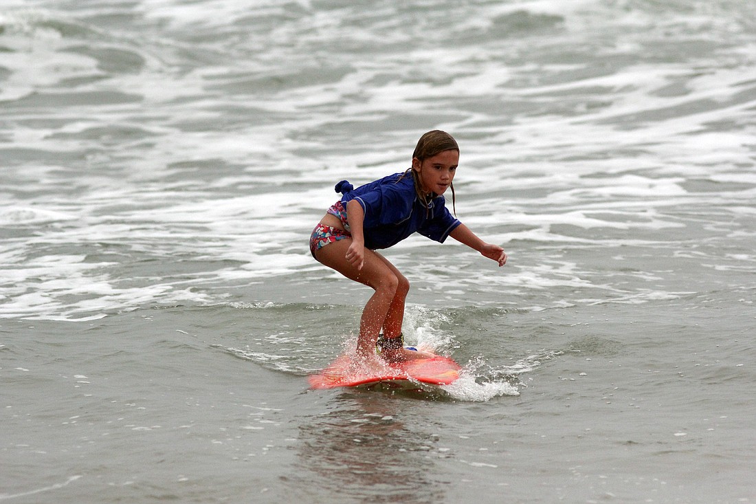 Niyah Rosen surfs in the Novice finals Saturday morning. She also took first place in the A-1 Surf & Skate Surf Camp Challenge. PHOTOS BY SHANNA FORTIER