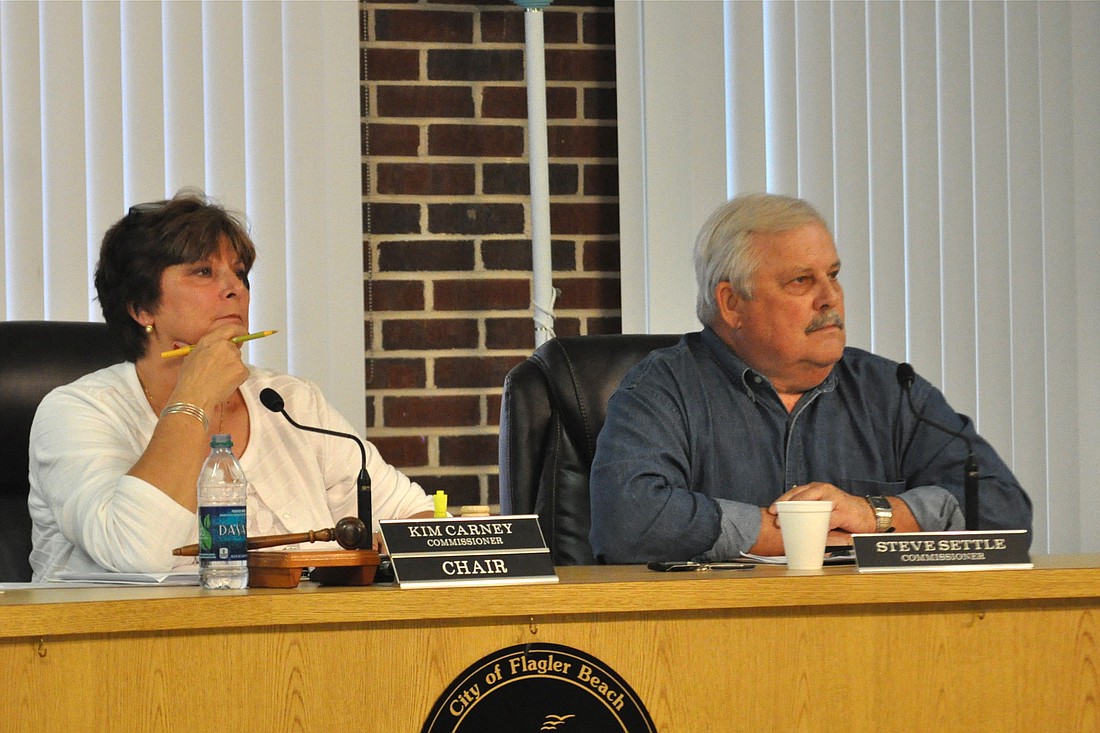 Commissioner Steve Settle, right, placed an item on the agenda for the upcoming Sept. 25 meeting to remove Commission Chairwoman Kim Carney, left, from her position at the head of the commission.