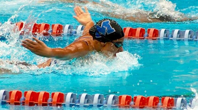 Madison O'Keefe loves to see her opponents, as she races in the 100 butterfly.