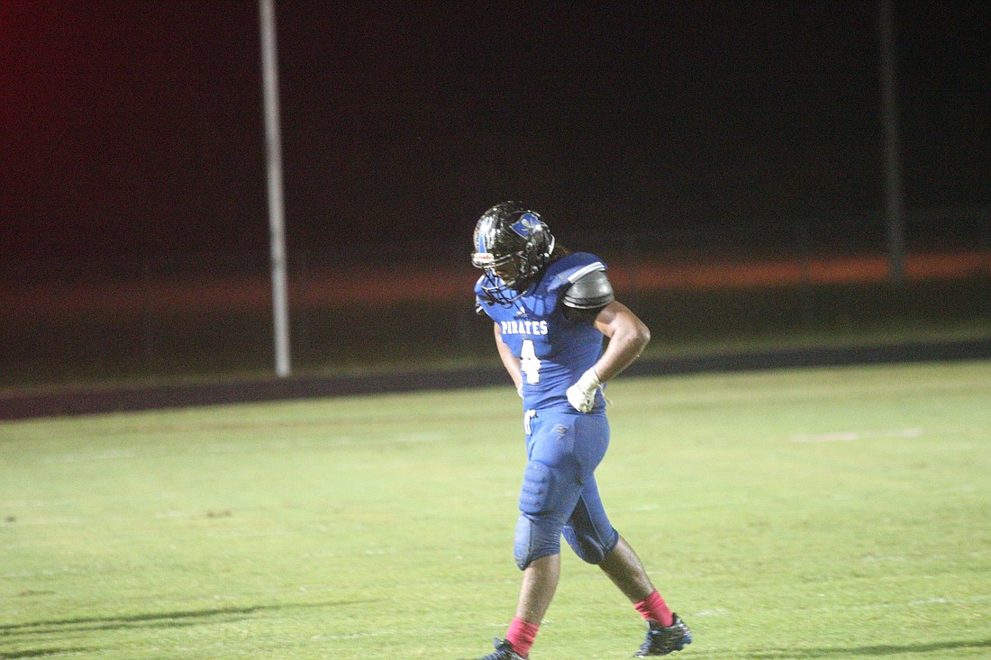 Running back Daniel Dillard walks off the field after a fumble late in the fourth quarter.